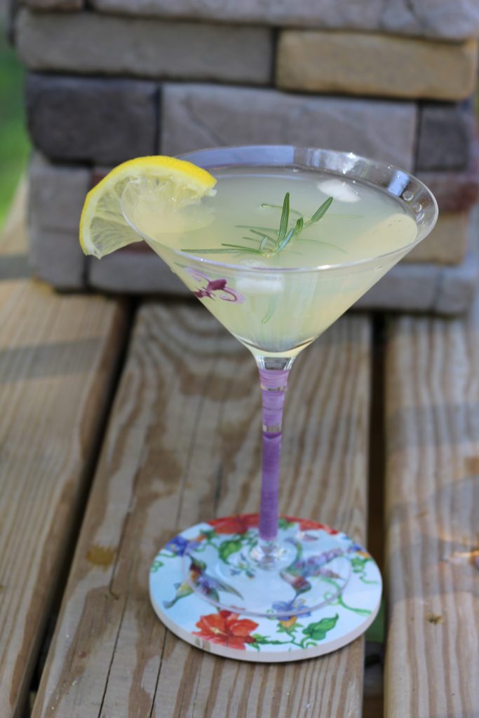 martini garnished with lemon and rosemary