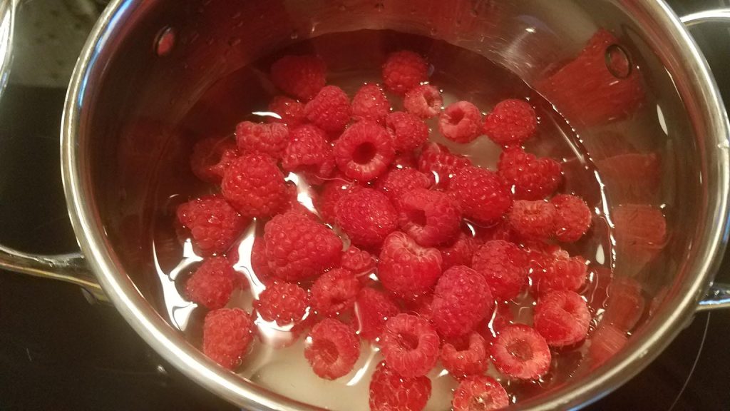 cooking down the raspberries