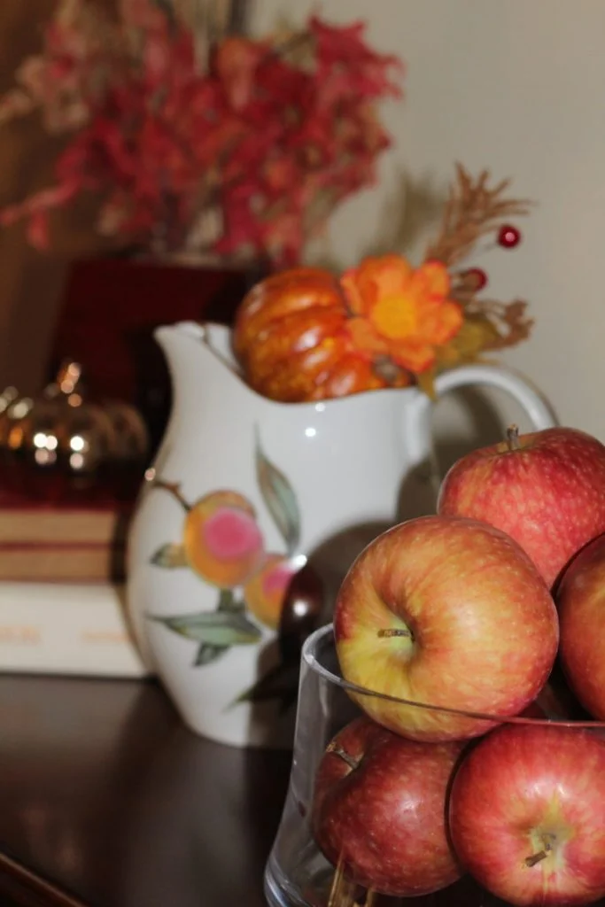 Fall Vignette Ideas - fresh apples and pitcher of faux pumpkins