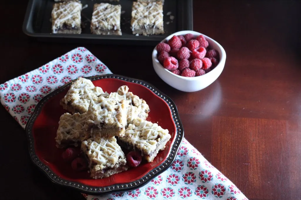 white chocolate raspberry bars on a serving tray