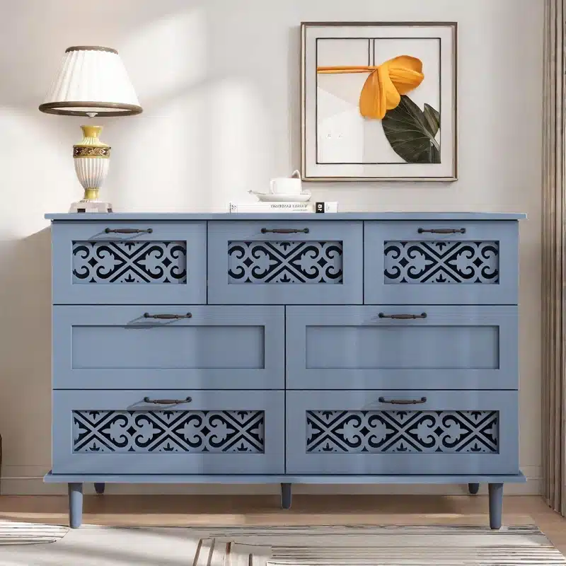 Grayish blue dresser with cared drawer fronts