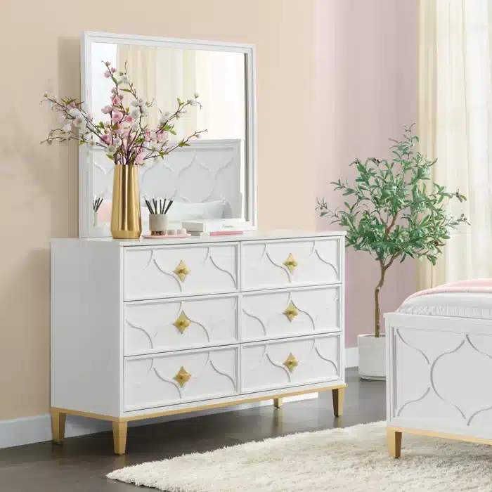 Modern dresser with geometric design on front and gold handles and trim