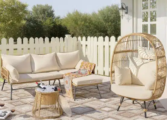 outdoor patio set in wicker with cushions, couch, ice bucket stand and boho egg chair
